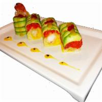 Christmas Roll · Lobster tempura, mango inside wrapped in soy paper, spicy crunchy tuna, avocado, tobiko with...