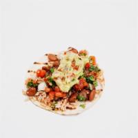Veggie Taco · Spanish rice, pinto beans, house salsa, guacamole, salsa verde, cilantro.