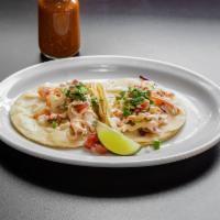 Shrimp Taco · Seasoned shrimp taco topped with cabbage, pico de gallo, chipotle dressing, and cheese (regu...