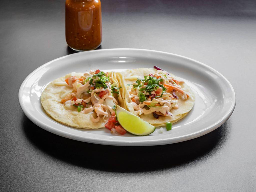 Shrimp Taco · Seasoned shrimp taco topped with cabbage, pico de gallo, chipotle dressing, and cheese (regular size corn tortilla).