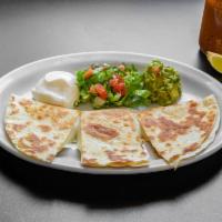 Chicken Quesadilla · 10 inches flour tortilla filled mozzarella cheese and white meat served with sour cream and ...