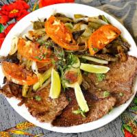 Bistec con Nopales · Sirloin steak with cactus. Grilled sirloin steak with onions and paprika seasoning, topped w...