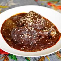 Chicken Mole · Oaxacan style. Complex and delicious signature Mexican spicy sauce corn prides of more than ...