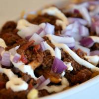Chili Cheese Fries · Beef chili, cheddar, red onion and sour cream.