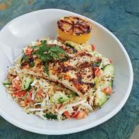 Grilled Mahi Mahi Bowl · Quinoa, green cabbage, cucumbers, marinated artichokes, mixed olives, tomatoes and tossed wi...