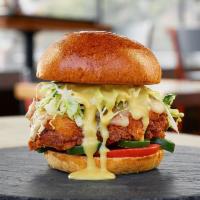 Southern Fried Chicken Sandwich · Buttermilk brined, jalapeno jack, tomatoes, coleslaw, fresh jalapenos, with honey dijon on a...