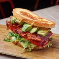 BLT & A Sandwich · Applewood smoked bacon, lettuce blend, tomatoes, avocado, garlic aioli, griddled sourdough.