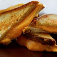 Grilled Cheese Trifecta Sandwich · Tillamook cheddar, provolone and American cheeses on griddled sourdough.