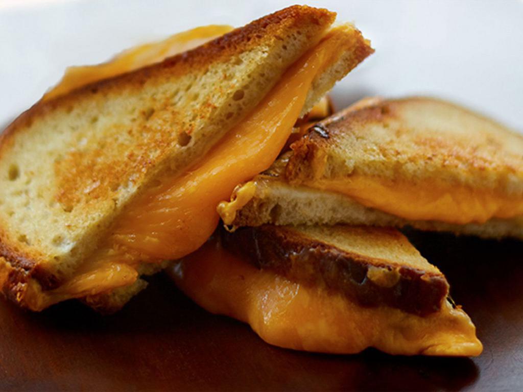 Grilled Cheese Trifecta · Tilamook cheddar, provolone and American cheese on griddled sourdough.