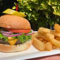 Annie's Burger · 1/2 pound burger cooked to your preference, American cheese and bacon. Lettuce, tomato, onio...
