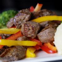 8oz Bull in the Pan (small) · 8oz Marinated sirloin tips grilled with roasted bell peppers and onions. Served with two sid...