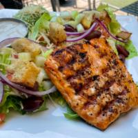 Blackened Salmon Salad · Baby field greens, red onion, tomatoes, garlic herb croutons and champagne vinaigrette.