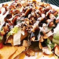 BBQ Chicken Nacho · Fried corn tortilla chips, topped with chicken, tomatoes, lettuce, crispy bacon, melted chee...