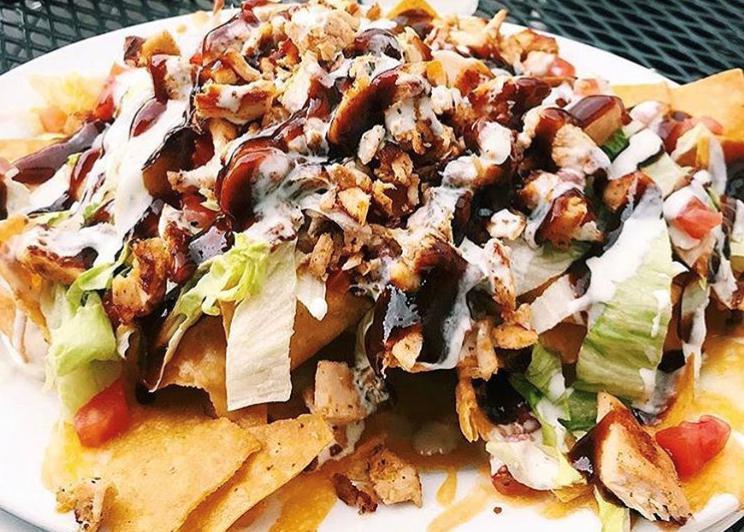 BBQ Chicken Nacho · Fried corn tortilla chips, topped with chicken, tomatoes, lettuce, crispy bacon, melted cheese, drizzled with BBQ
sauce & ranch dressing. Try it with pulled pork instead of chicken!