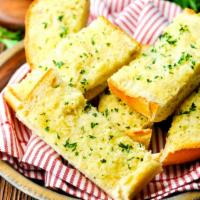 GARLIC BREAD · Buttery bread that is topped with garlic.