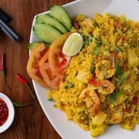 Pineapple Fried Rice · Jasmine rice stir fried with yellow curry powder, pineapple, egg, cashew nuts, peas, carrots...