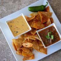 Queso, Fire Roasted Salsa and Chips · Add guacamole for an additional charge.