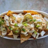 Build Your Own Nachos · Served with queso with tortilla chips.