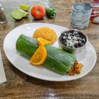 Cochinita Pibil · Pork marinated with achiote and citrus juices, bake with a banana leaves, served with rice, ...