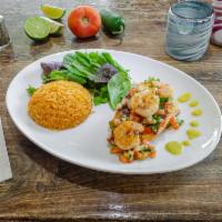 Salmon Tropical · Grilled salmon top with shrimp cover at tropical pico de gallo served with rice and spring m...