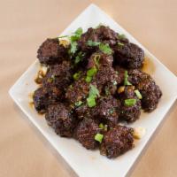 Vegetable Manchurian · Vegetarian deep fried balls tossed with soya sauce based gravy cooked to chef's perfection.