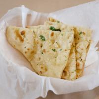 Garlic Basil Naan · Flat bread topped with garlic and basil- chef recommendation.