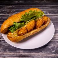 Shrimp Po-Boy Sandwich Combo · Comes with any side and drink. Served with Homemade Tartar Sauce, lettuce, tomato, purple on...