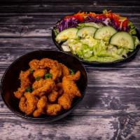 Fish Salad · hand-battered, served over a garden salad with lettuce, tomato, cucumber, purple cabbage, pu...