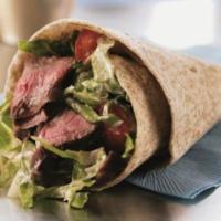 Grilled Steak Kabob Wrap · Marinated steak served with choice of lettuce, tomatoes, onions, pickles, hummus, tahini, tz...