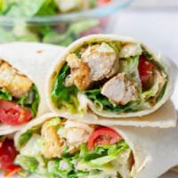 Grilled Chicken Caesar Wrap · Marinated grilled chicken served with lettuce, tomato, cucumber, parmesan, croutons and caes...