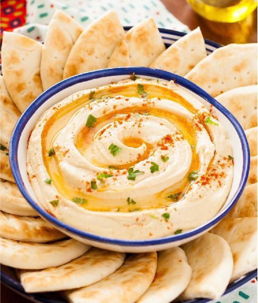 Hummus · A unique blend of chickpeas, tahini, lemon juice, salt and garlic. Served with pita bread on the side. 