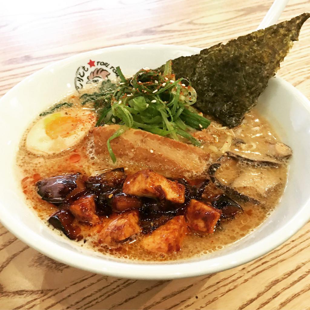Mapo Tofu Ramen · Tofu and eggplant in spicy hoisin sauce with pork miso broth, pork belly, 1/2 soft-boiled egg, shiitake, spinach, beansprout, and 7 spices. Vegetarian or vegan options are available. Spicy.