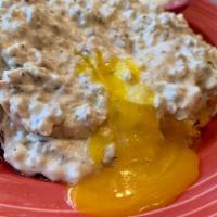 Biscuit, Eggs and Gravy · Split biscuit topped with scrambled eggs and our own chicken sausage gravy, served with choi...