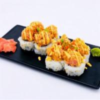 Dynamite Roll · California roll with spicy tuna on top, finished with spicy mayo sauce, tempura flakes, scal...