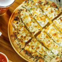 Cheesy Breadstix · Brushed with garlic butter & topped with mozzarella, muenster, cheddar & parmesan. Baked to ...