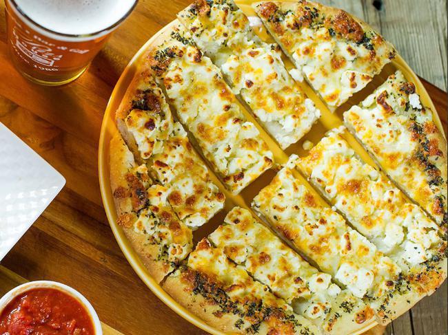 Cheesy Breadstix · Brushed with garlic butter & topped with mozzarella, muenster, cheddar & parmesan. Baked to perfection.