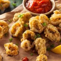 Fried Calamari · Tender Domestic Calamari marinated in milk, lightly battered and fried to a crispy golden br...