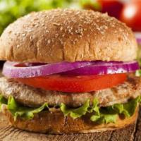 Turkey Burger · A juicy, seasoned turkey burger topped with lettuce, tomato, and red onion. A delicious alte...