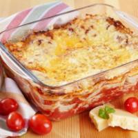 Cheese Lasagna · Our traditional lasagna with four Italian cheese and marinara served with fresh oven-baked g...