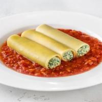 Manicotti · Ricotta cheese filled rolled pasta, baked in your choice of sauce, and topped with mozzarell...