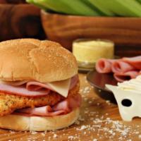 Chicken Cordon Bleu Sandwich · Romano chicken breast topped with ham, Swiss cheese, lettuce, and tomato. Served with choice...