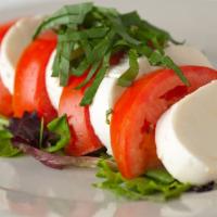 Mozzarella Tomato and Basil · fresh mozzarella, sliced hothouse tomatoes, fresh basil, baby arugula, Tuscan kale, extra vi...