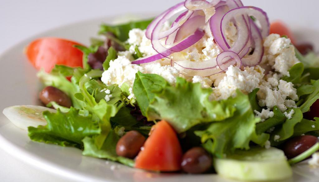 Large Greek Salad · seasonal mixed greens, tomatoes, cucumbers, red onions, feta, kalamata olives and lemon vinaigrette