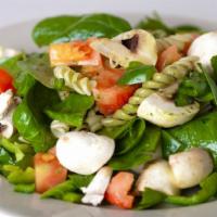 Spinach Pasta Salad · fresh spinach, tri-color rotini pasta, tomatoes, roasted mushrooms, bell peppers, pesto, za'...