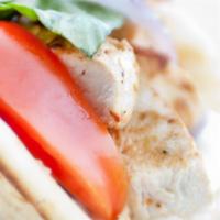 Grilled Chicken Pita · grilled marinated all-natural chicken breast, garlic sauce, seasonal mixed greens, tomatoes,...