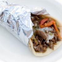 Philly Steak Pita · premium shaved beef cuts, roasted bell peppers and onions, roasted mushrooms, mozzarella, gr...