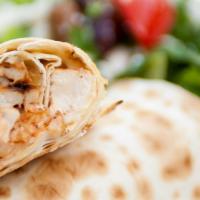 Lavash Shawarma Wrap · grilled marinated all-natural chicken breast, garlic sauce, roasted tomatoes and onions, lav...