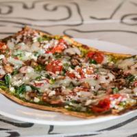 Spinach and Pesto Lavash Pizza · spinach, roasted mushrooms, wood-fired tomatoes, pesto, herbs, mozzarella, feta and thin lav...