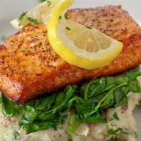 Wood-Fired Norwegian Salmon* · norwegian salmon, garlic-herb smashed potatoes and wilted spinach.