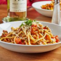 Buccatini · Calabrian Chili's, Crumbled Sausage, Roasted Garlic, Fresh Tomatoes